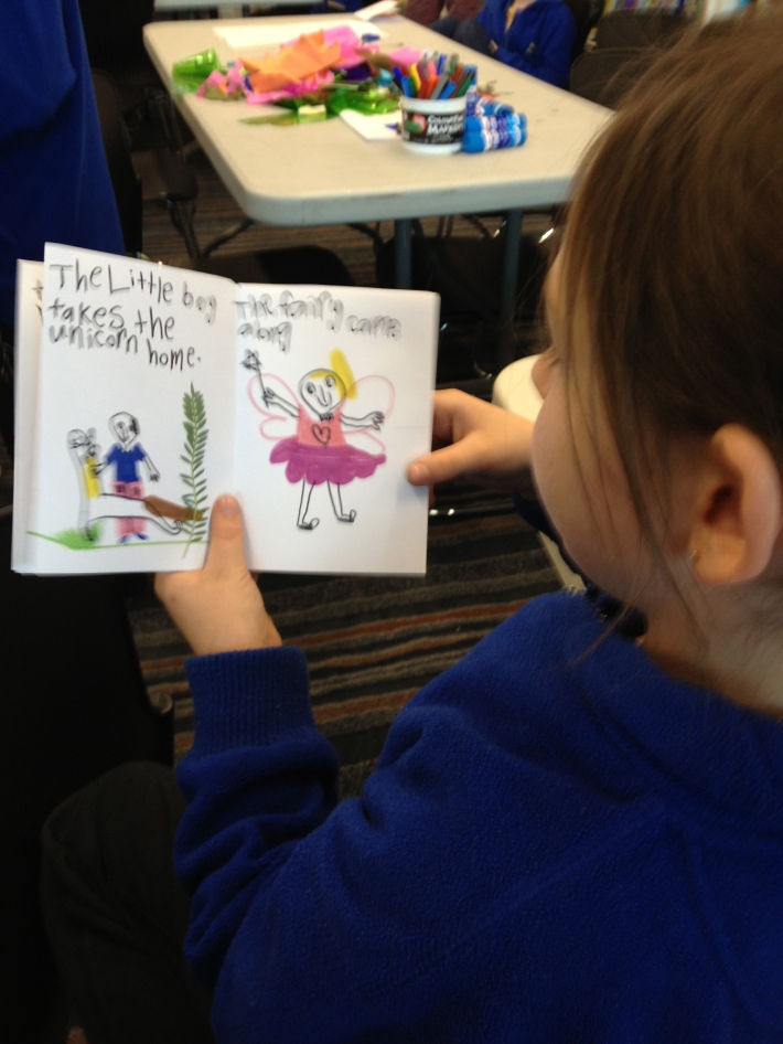 Student in Port Pirie proudly reading her book 'The Little Boy and the Unicorn' to her classmates